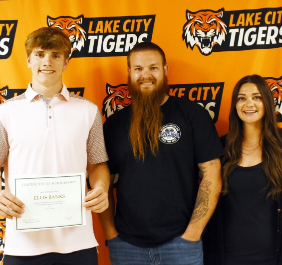 Daran Atkinson Memorial Scholarship, $500. From left are recipient Ellis Banks and presenters Chris and Courtney Atkinson.