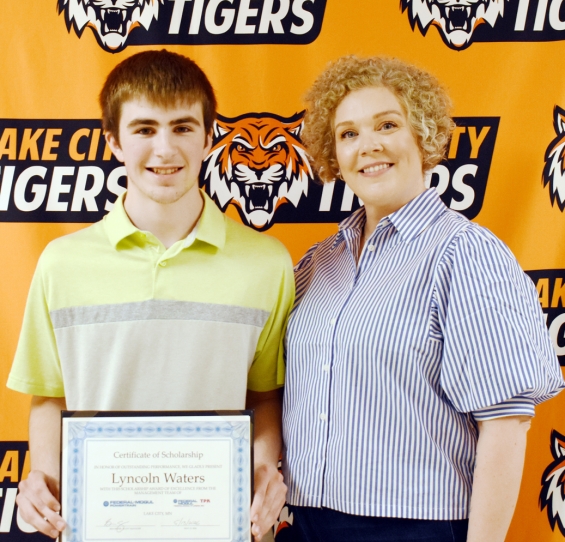 Federal-Mogul TPLiners Scholarship, $1,000. From left are recipient Lyncoln Waters and presenter Leah Zach.