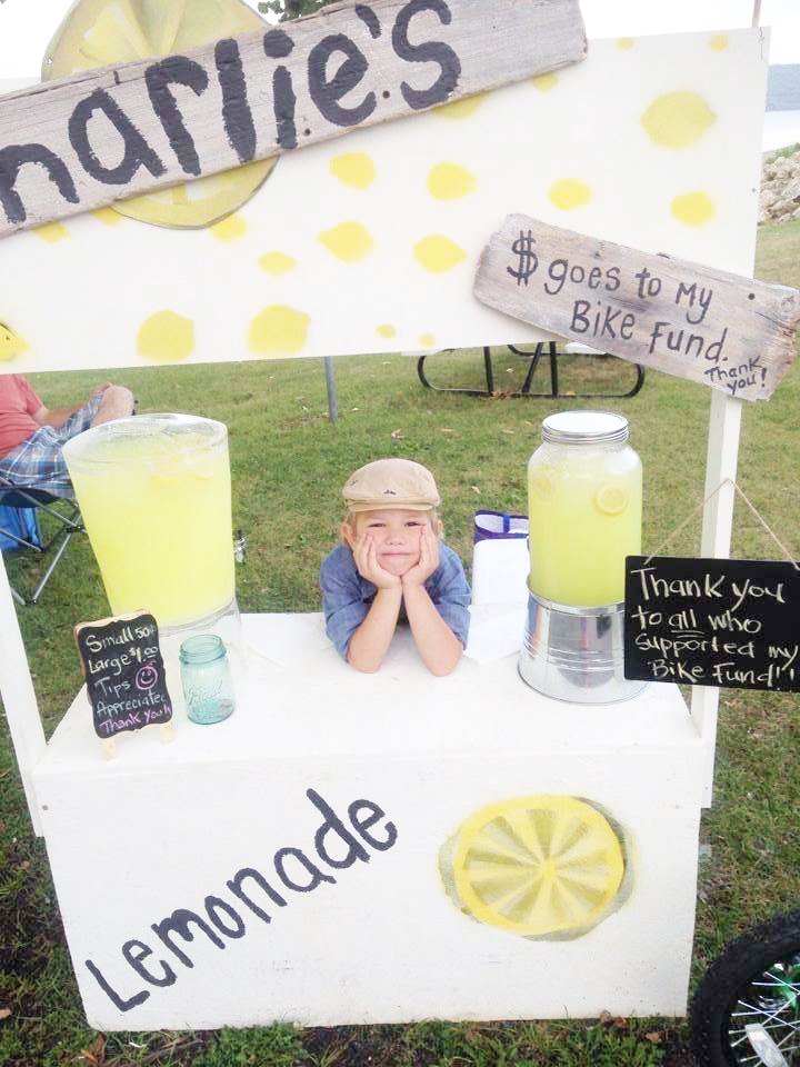 Four-year-old Charlie all dressed up to sell enough lemonade to buy a bike.