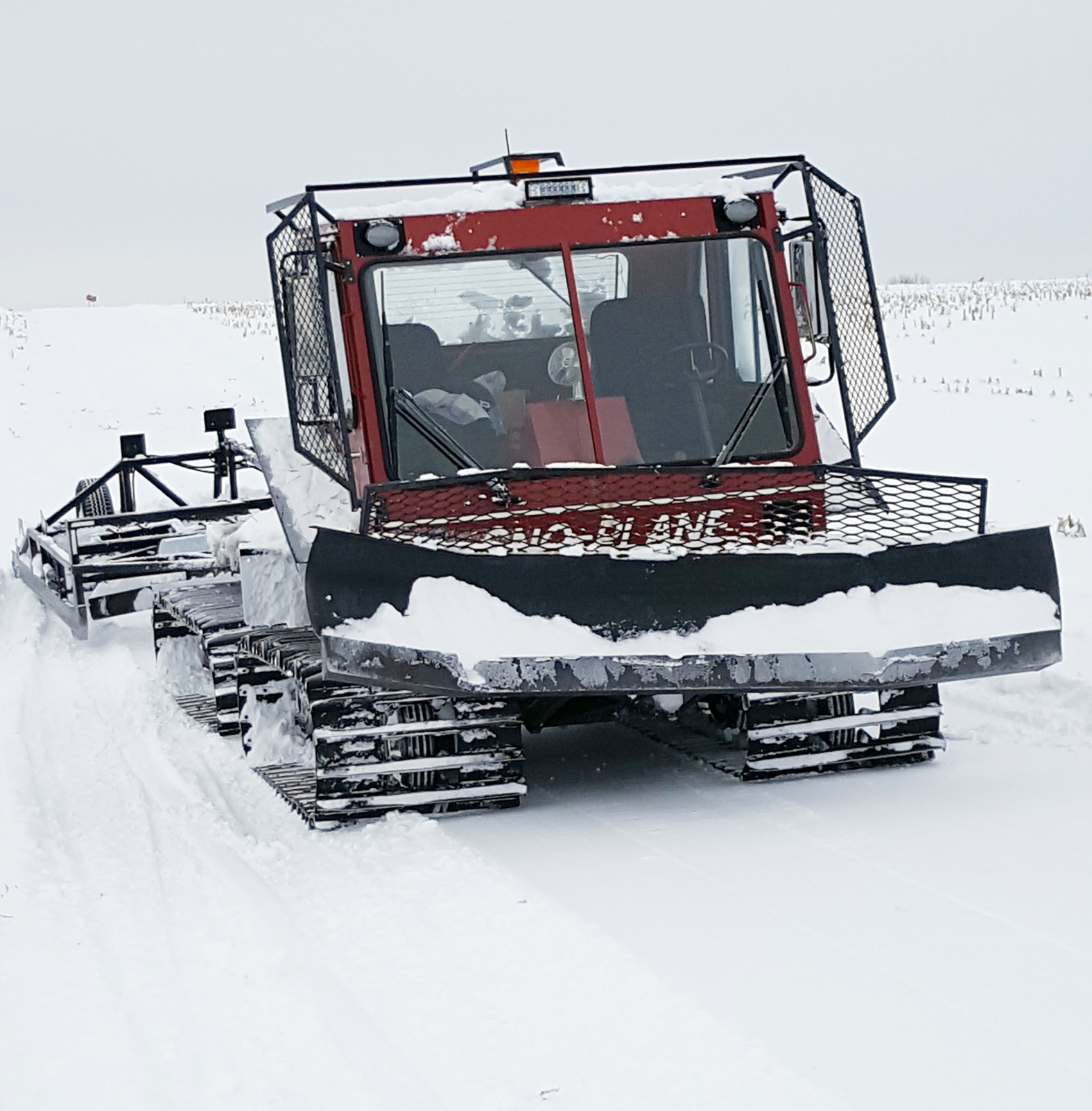 A snowmobile trail groomer.